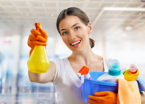 Carpet cleaning professional preparing equipment in a BR3 home