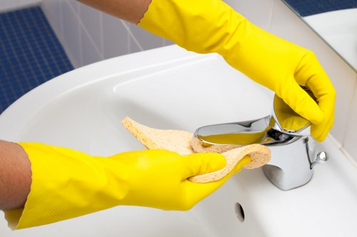 Technician cleaning a mattress in a BR3 flat with careful access